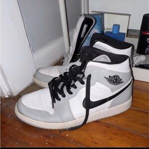 White and Gray High-Top Sneakers with Black Accents